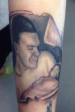 small black and grey fther portrait tattoo